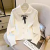 Nuevo suéter de punto para mujer de otoño e invierno, estilo transfronterizo, con cuello de muñeca y lazo de encaje, top elegante y de alta gama estilo francés