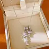 Collar con cruz en forma de corazón adornada con circonitas, cadena para clavícula de lujo ligero de nicho, único y elegante con un toque de alta gama, venta al por mayor