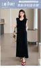 Vestido de maternidad negro versátil de alta gama europeo, nuevo en la moda de verano 2026, con un aspecto sofisticado y hermoso