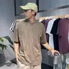 Camiseta masculina de alta qualidade, design desconstruído com corte tridimensional minimalista, manga curta, modelagem solta estilo americano, tendência de verão.