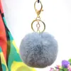 Al por mayor en stock Bola de pelo de imitación de conejo Rex de 8 cm llavero colgante lindo para mujer bolso de coche teléfono móvil colgante de felpa