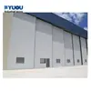 Puertas apilables resistentes al viento para hangares de aeronaves, puertas eléctricas de hangar para fábricas, puertas resistentes al viento suministradas de fábrica con certificación de norma nacional