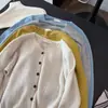 Nuevo cárdigan de punto de estilo coreano para mujer, cuello redondo, manga larga, tejido, holgado, adelgazante, versátil, con diseño calado, para principios de otoño de 2026