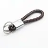 Chaveiro Criativo de Corda de Couro com Anel Duplo Tecido à Mão Acessórios de Chaveiro de Carro de Metal Pingente Fonte Atacado