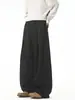 Pantalones deportivos casuales nuevos de corte holgado para jóvenes, pantalones negros de estilo americano fluidos para otoño, pantalones largos de pierna ancha con pliegues modernos para hombre