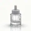 Em estoque Frasco conta-gotas transparente de 30ml com fundo grosso, frasco de vidro fosco à prova de luz para óleos essenciais, frasco dispensador de perfume com listras verticais