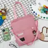 2025 Nuevo Estilo Coreano Bolso de Lona de Color Puro Simple Mochila Ligera Moda para Estudiante de Primaria Bolso Tote Escolar de Moda
