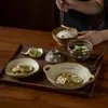 Juego de vajilla rústica de cerámica estilo japonés para una persona, con una combinación retro de cuenco y plato, adecuado para uso doméstico, incluyendo cuencos de arroz de cerámica, cuencos de sopa y platillos para condimentos, disponible para venta al por mayor