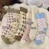Calcetines térmicos engrosados para otoño e invierno, diseñados para retener el calor, con una textura de rizo, calcetines de media pantorrilla para mujer, casuales y versátiles, con un diseño de bloques de color