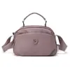 Bolsa de concha estilo japonés 2026 Modelo nuevo Bolso pequeño para mujer Ligero Casual Impermeable Tela de nylon Bolso de hombro cruzado Transfronterizo