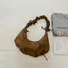 2026 Verano Nuevo de Moda Plisado Color Sólido Lazo Diseño de Nicho Pequeño Bolso de un Hombro Elegante Exquisito para el Viaje Bolso Cruzado