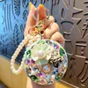 Espejo de Maquillaje Redondo Conveniente con Cadena para Llavero Colgante Decoración de Bolso de Moda Regalo Pequeño para Parejas
