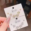 2025 Nuevo Estilo Caliente Exquisitos Pendientes Pequeños de Flor Perla Circonita Juego de Tres Pares Estilo Coreano Estilo de Lujo Accesible Set de 6 Piezas de Pendientes