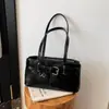 Bolso de axila de alta calidad estilo francés con un diseño moderno y único, un bolso de hombro y bolso de mano versátil para mujer
