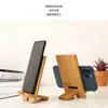 Soporte para teléfono móvil Nanzhu creativo de bambú y madera natural marco de soporte para teléfono móvil simple artefacto de drama set soporte para teléfono móvil con LOGOTIPO escolar