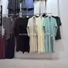 Estilo Nuevo Otoño e Invierno Vestido de Punto Perezoso con Tirantes Conjunto de Dos Piezas Cárdigan Suéter Largo Elegante Chaqueta para Mujer por Encima de la Rodilla