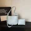 Bolso cruzado casual de diseño de nicho de moda transfronterizo, patrón simple de lichi, bolso de alta gama para madre e hija para ir al trabajo, bolso cruzado versátil