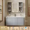 Tocador de baño engrosado y ahorrador de espacio con diseño en color crema, que cuenta con un lavabo redondeado, lavabo cerámico integrado y un lavabo de una sola pieza.