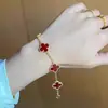 Pulsera de trébol de cuatro hojas y cinco flores para mujer, aleación de cobre, fabricantes al por mayor, versión alta, no se decolora, trébol de cuatro hojas, sentido de alto nivel