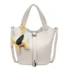Bolso de mano tipo cubo de cuero suave simple estilo coreano para mujer, Nuevo modelo 2026, Bolso de hombro cruzado, Bolso tote pequeño súper popular para salir