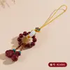 Al por mayor Mineral Crudo Natural Alto Contenido Cinabrio Oro Púrpura Amuletos para Teléfono Retorcidos a Mano, Bolsas de la Suerte, Llaveros, Colgantes para Bolsos, Artículos Populares