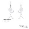 Pendientes colgantes de persona pequeña con cara sonriente divertida, personalidad creativa de gran venta en Europa y Estados Unidos, hueso de la suerte de dibujos animados divertido, dedo medio vertical