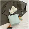 2025 Nova Bolsa Balde Simples Tecida Bolsa de Ombro Feminina Niche para Deslocamento Coreana Ins Moda