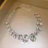 Colar com pingente oval em contas e diamantes, transfronteiriço europeu e americano, corrente para clavícula de luxo leve e de alta qualidade, acessório feminino requintado e versátil