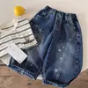 Calça Longa Infantil 2026 Outono Novidades Meninos e Meninas Patchwork Solta Jeans Estampado Bebê Estilo Coreano Calça Estrela
