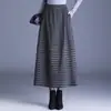 Saia xadrez de lã estilosa para mulheres, novo modelo outono/inverno 2026, cintura elástica, corte solto para corpo tipo pera, saia tulipa moderna