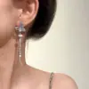 Brincos Assimétricos com Borboleta e Pingente de Pérola para Mulheres 2026 Novo Estilo Luxo Leve High-End Elegantes Brincos Mais Vendidos