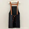 Delantal de lona moderno con logo estampado, nuevo diseño simple, anti-manchas y resistente al desgaste, especializado para servicio de comedor, ropa de trabajo para mujer