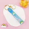 Llavero Colgante de Cordón de Cuero con Letra Transparente Brillante con Accesorios Estilo Muñeca Rellena de Aceite Encanto de Llavero Pulsera Venta al por Mayor