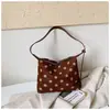 Bolsos vintage de gamuza para otoño e invierno para mujer 2026 nuevos bolsos de moda bolso de hombro de lunares bolso cruzado bolso tipo cubo