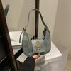 Grande capacidade retro elegante bolsa crescente outono e inverno nova moda borla bolsa de ombro leve luxo all-match bolsa de axila atacado