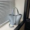 Bolso tipo cubo canasta de verduras de nicho bolso de mujer sensación de alta gama bolso de mano pequeño bolso cruzado de moda para el trabajo bolso texturizado bolso de mujer