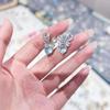 Exquisitos aretes de botón con forma de corazón y moño con microincrustaciones de pequeños diamantes de imitación brillantes Azules de diamantes completos Aretes simples de rábano de fácil combinación