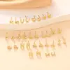 Pendientes de botón con alfabeto inglés 26 de moda europea y americana transfronteriza, pendientes nuevos de material de cobre, joyería para orejas de moda simple y versátil