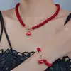 Europa y Estados Unidos transfronterizo nuevo traje de collar de pulsera de perlas para mujer alto sentido diamante amor perla roja collar venta al por mayor