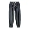 Pantalones casuales ajustados cónicos de forro polar Boao para otoño e invierno con puños elegantes