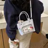 Bolso de mano pequeño dulce y lindo para niñas, nuevo modelo 2026, bolso tipo cubo simple para llevar en la mano, bolso cruzado versátil de verano