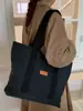 Bolsa Tote Comutadora de Lona Transfronteiriça para Mulheres 2025 Inverno Nova Tendência Grande Capacidade Estilosa Simples de Ombro ou Axila