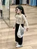 Otoño 2024 nueva ropa infantil coreana para niñas estilo chica popular camiseta corta con orejas de madera pantalones negros pantalones rectos