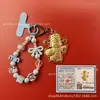 Llavero de tela con logo de empresa personalizado Cadena para teléfono móvil Angela Lámina de oro puro Oro 999 Regalo de aniversario
