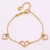 Pulseira com Pingente de Coração Duplo com Zircônia Inlay de Cobre Cdd, Disponível em Preto e Branco, Acessórios Femininos da Moda, Fábrica de Origem para Atacado