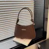 Moda Estilo Coreano Textura Simples Alça com Nó Bolsa Pequena Feminina 2026 Chegada Nova de Verão Cor Sólida Bolsa Transversal Bolsa Quadrada Pequena