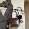Bolso de mano de lujo accesible de moda para mujer 2025, bolso cruzado casual tipo cubo para hombro, bolso de alta gama