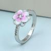 Zhenrong, fuente transfronteriza de joyería europea y americana, producto estrella de cine y televisión, anillo Three Life III de flor de durazno, anillo de pegamento para mujer hecho a mano.