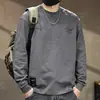 Camiseta masculina de manga longa para primavera 2026 nova marca da moda resistente estilosa ins solta casual gola redonda camisa básica