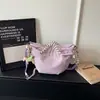 Bolsa cruzada de tela Oxford con diseño casual de textura de nicho, bolsa para dumplings, nueva de verano 2026, con cordón y plisada, para mujer